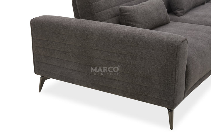 Gray sofa with 'Marco Furniture' branding on a white background