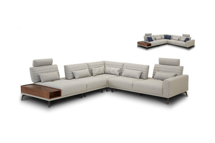 Gray sectional sofa with wooden coffee table on a white background