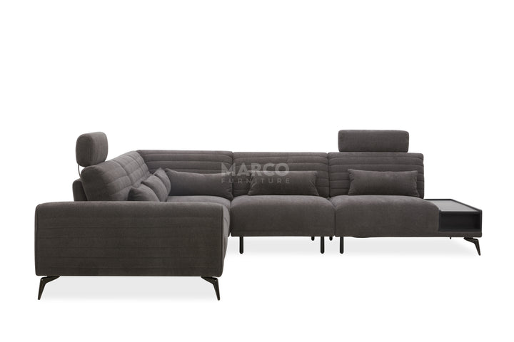 Gray sectional sofa with a coffee table on a white background, branded 'Marco'.