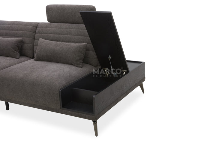 Gray sectional sofa with a built-in coffee table on a white background, featuring the Marco brand.