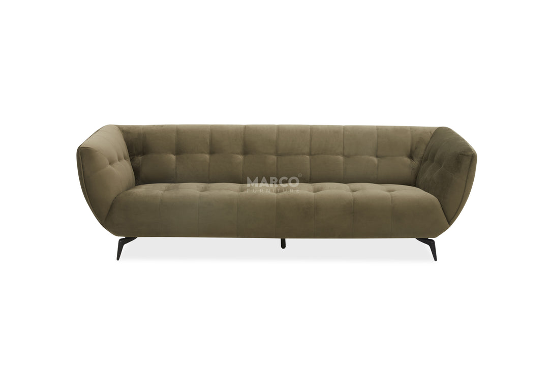 Green sofa with tufted design on a white background