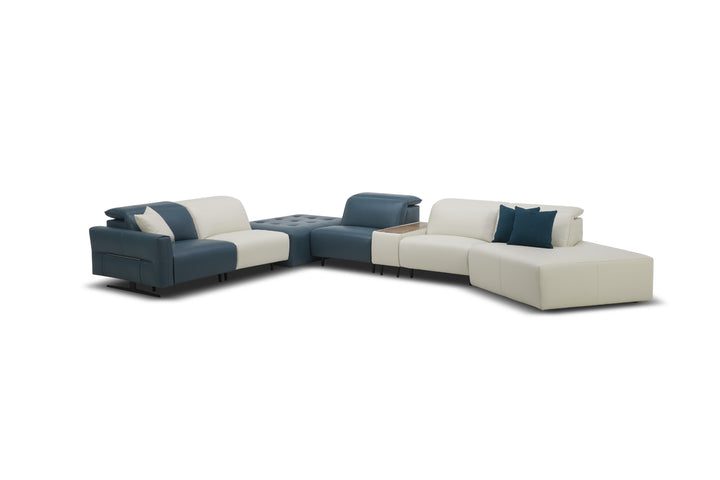 Sectional sofa with blue and beige cushions on a white background