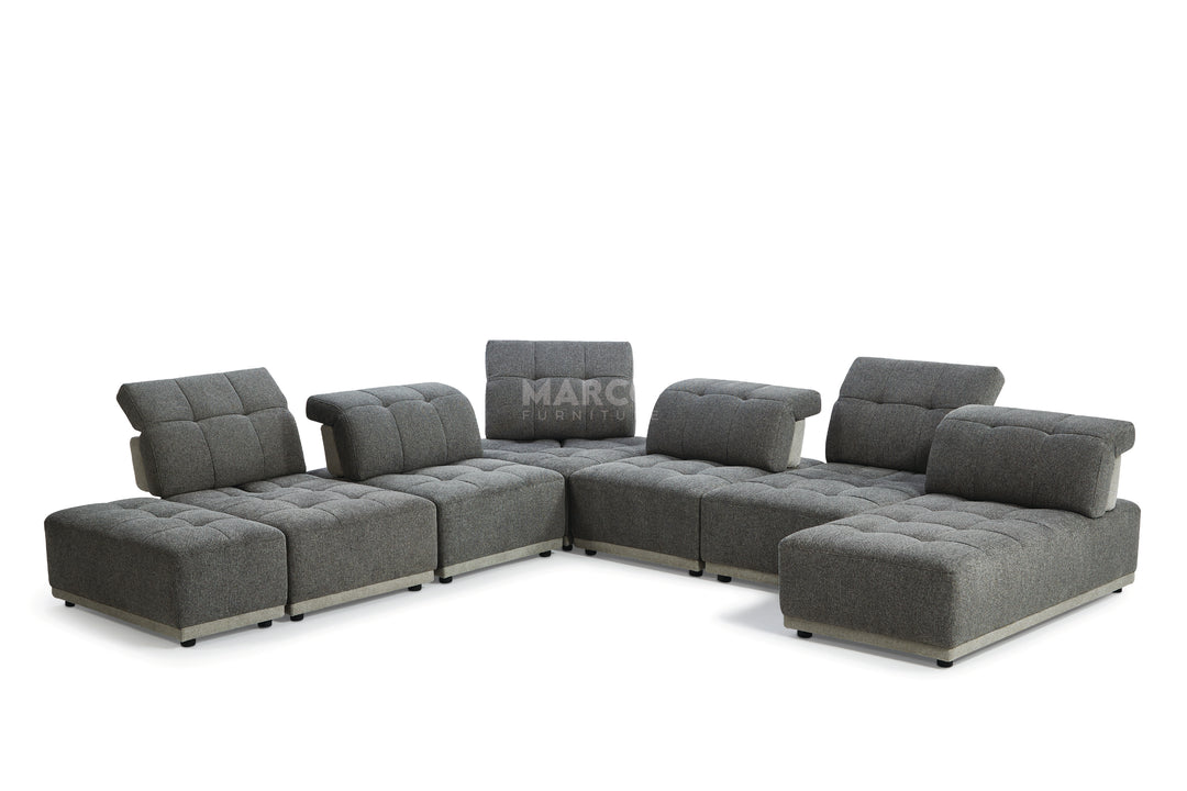 Gray sectional sofa with 'MARC' branding on a white background