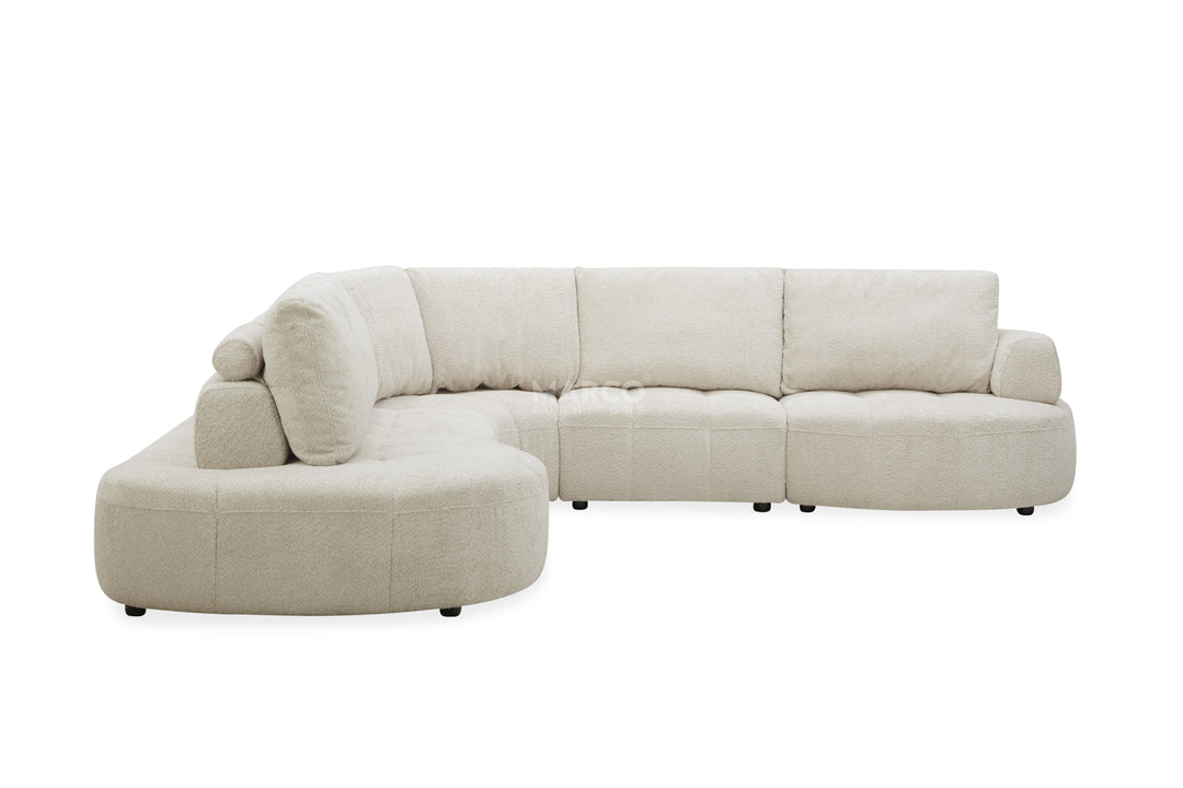 Beige sectional sofa on a white background