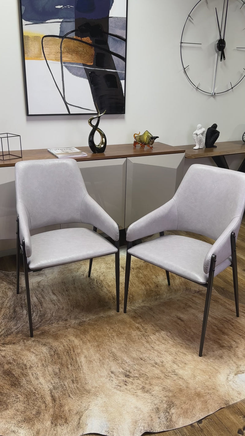 Oliver Designer Leather Dining Chair with Carbon Steel Frame and Curved Backrest