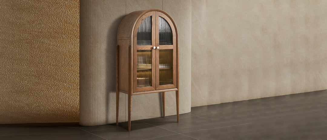 Wooden arched cabinet against a textured wall