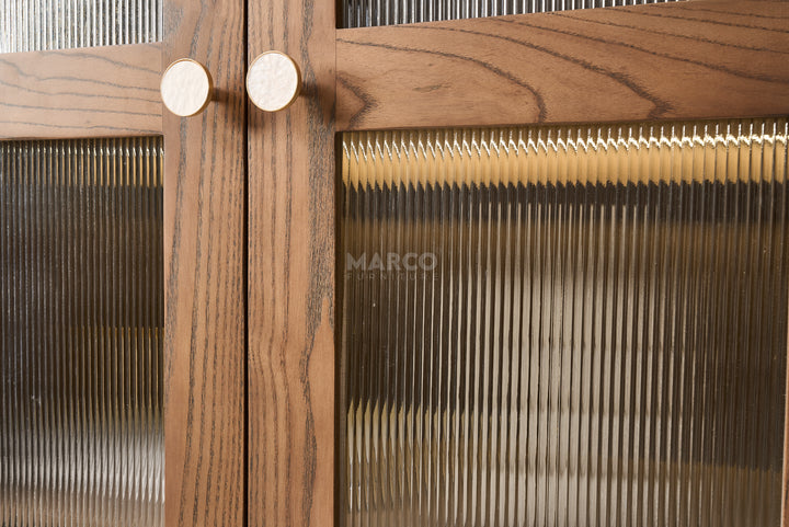 Wooden cabinet with glass doors and 'MARCO' branding