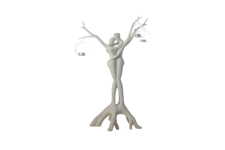 White decorative sculpture of a woman with branches for hair on a white background