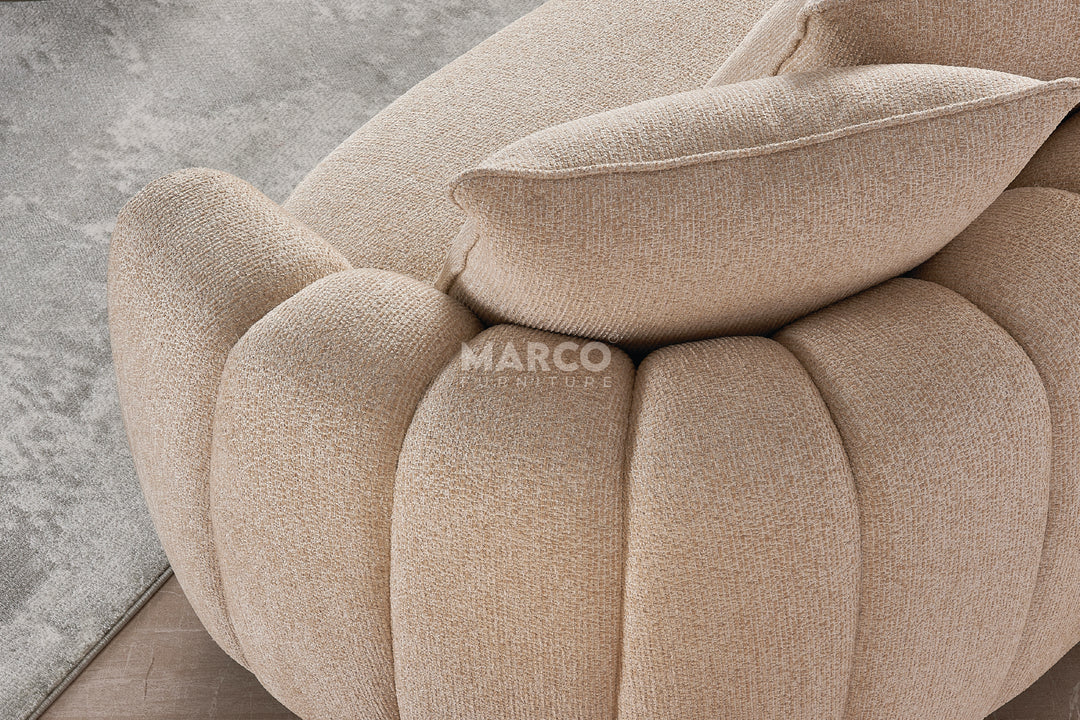 Beige textured sofa with cushions on a light gray background