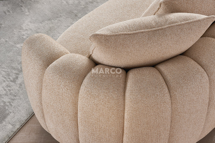 Beige textured sofa with cushions on a light gray background